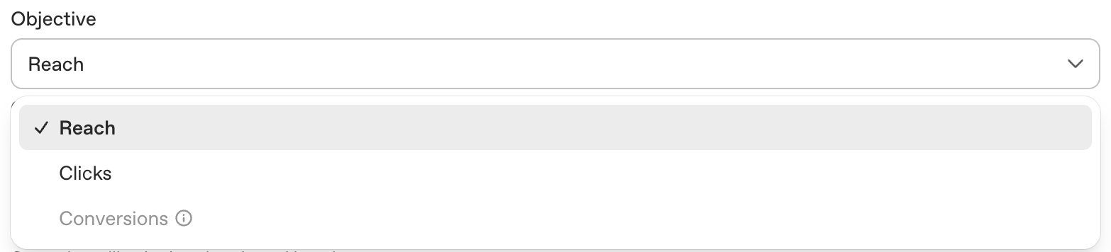 Campaign objective dropdown showing Reach, Clicks, and Conversions